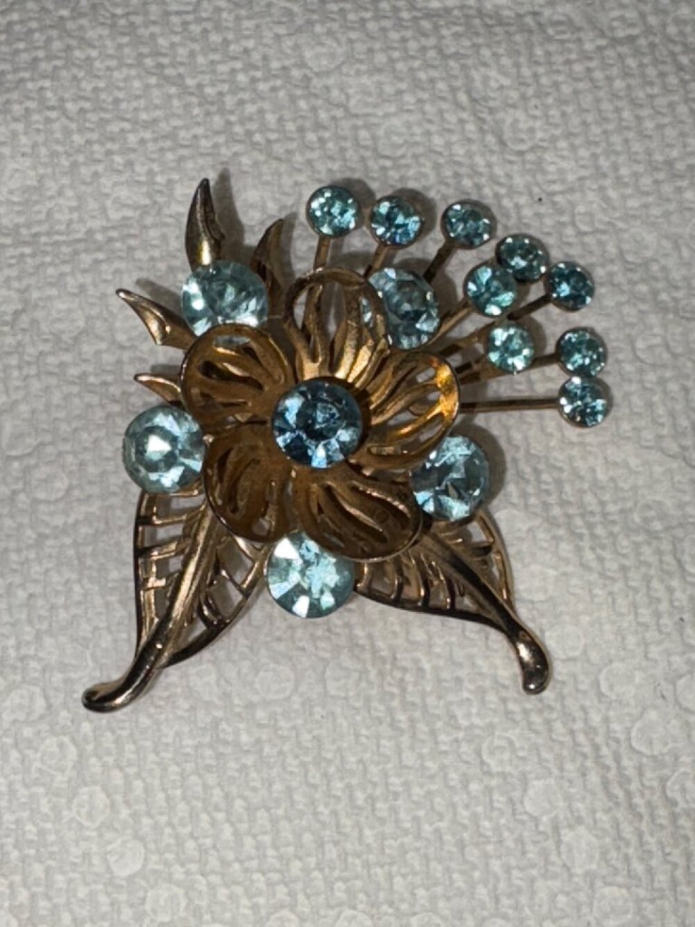 Vintage Gold Tone Floral Brooch With Blue Rhinestones Leaf Accents & Safety Clas